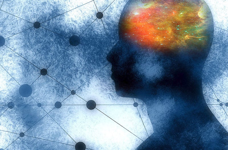 A conceptual image showing a person in blue with a glowing, clouded brain and interconnected nodes and lines in background.