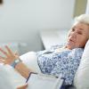 Older woman in a hospital bed Older woman in a hospital bed