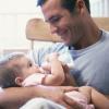Father feeding his baby boy Father feeding his baby boy