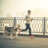 Woman jogging with a dog Woman jogging with a dog
