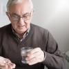 Elderly man with medicine Elderly man with medicine