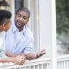 Father talking with his son on the porch Father talking with his son on the porch