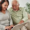 Older couple looking up health information on a laptop Older couple looking up health information on a laptop