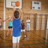 High school kids playing basketball in a gym High school kids playing basketball in a gym