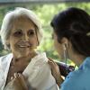 Physician listens to her senior patient's heart Physician listens to her senior patient's heart