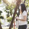 Two women talking outside with masks and social distancing