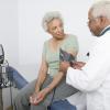 Doctor measuring blood pressure of a senior black woman Doctor measuring blood pressure of a senior black woman
