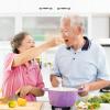 Senior couple cooking vegetables Senior couple cooking vegetables