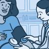 Health care provider taking pregnant woman's blood pressure.