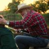 Man chatting with grandson while fishing Man chatting with grandson while fishing.