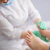A doctor examining a patient's foot A doctor examining a patient's foot