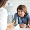 Boy who is overweight getting his blood pressure checked by health care professional Boy who is overweight getting his blood pressure checked by health care professional.