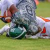 High school football player landing on their head High school football player landing on their head.