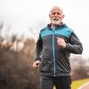 Older man jogging outside.