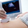 Woman getting an ultrasound on her belly.