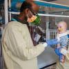 Doctors with the infant patient who received personalized gene therapy for rare life-threatening genetic disorder.