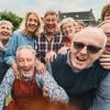 A group photo of older adults outside.    