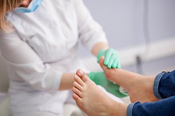 A doctor examining a patient's foot