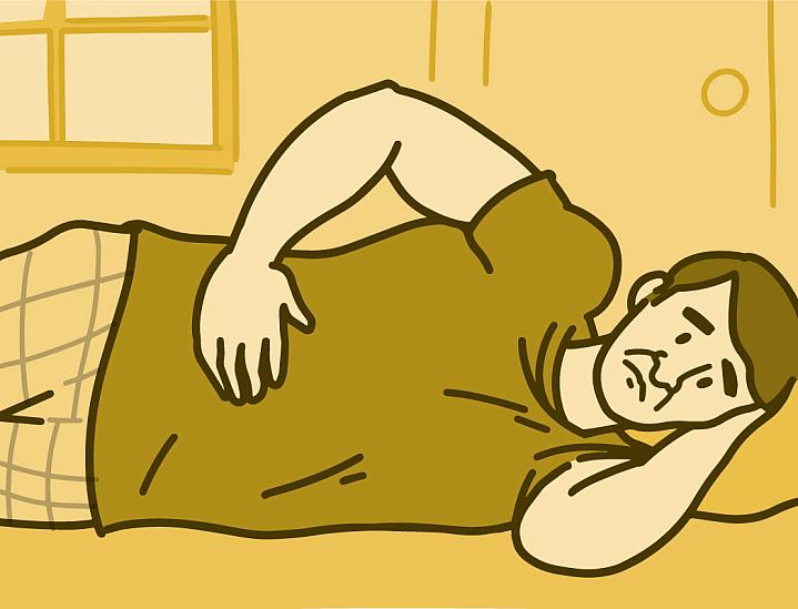 Illustration of a man lying on his side in pain with his hand on his stomach.